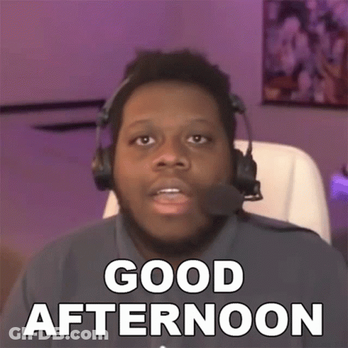 A Man Wearing Headphones Says " Good Afternoon " While Sitting In A Chair GIF