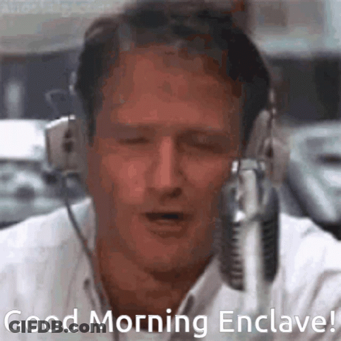 A Man Wearing Headphones Says " Good Morning Enclave " In Front Of A Microphone GIF