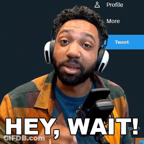 A Man Wearing Headphones Says Hey Wait In Front Of A Microphone GIF