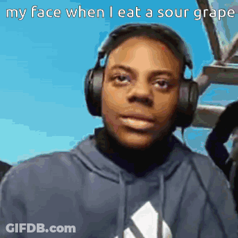 A Man Wearing Headphones Says His Face When He Eats Sour Grapes GIF