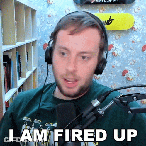 A Man Wearing Headphones Says " I Am Fired Up " GIF