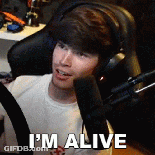 A Man Wearing Headphones Says I 'M Alive GIF