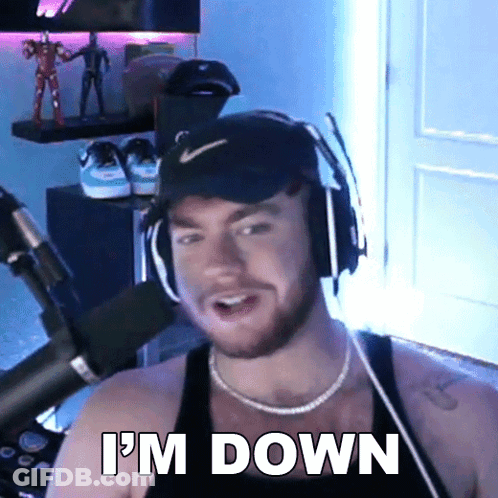 A Man Wearing Headphones Says I 'M Down In Front Of A Microphone . GIF