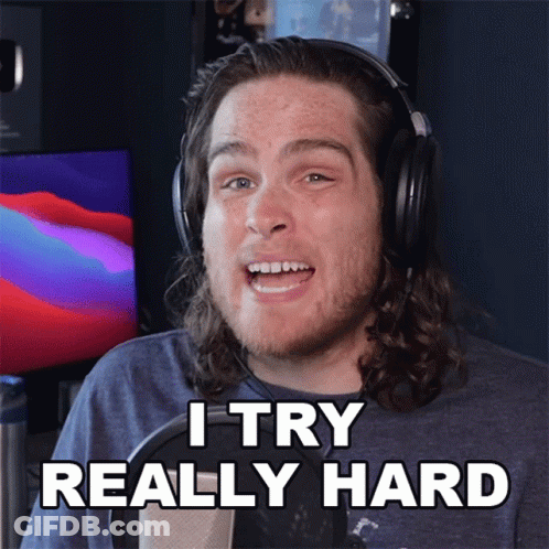 A Man Wearing Headphones Says " I Try Really Hard " In Front Of A Microphone GIF