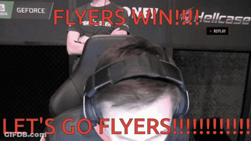 A Man Wearing Headphones Says Let 'S Go Flyers In Red GIF