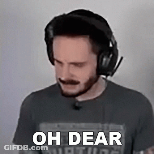 A Man Wearing Headphones Says " Oh Dear " In Front Of His Face GIF