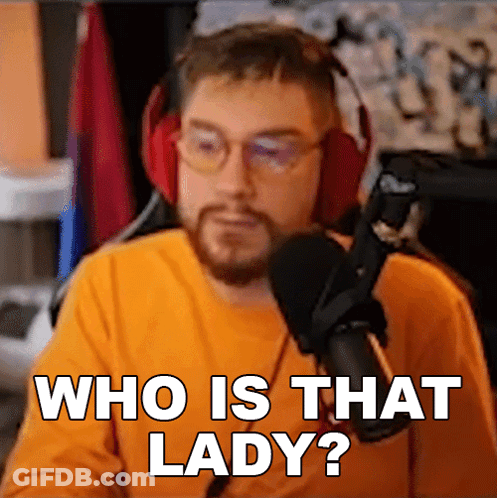 A Man Wearing Headphones Says Who Is That Lady In Front Of A Microphone GIF