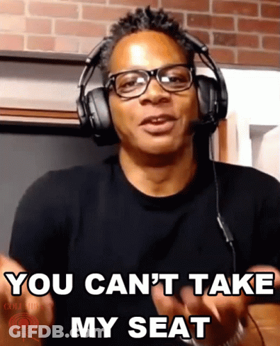A Man Wearing Headphones Says " You Can T Take My Seat " GIF