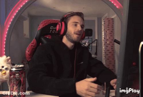 A Man Wearing Headphones Sits In A Chair That Says Cw 108 On It GIF