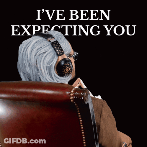 A Man Wearing Headphones Sits In A Chair With The Words I 'Ve Been Expecting You GIF