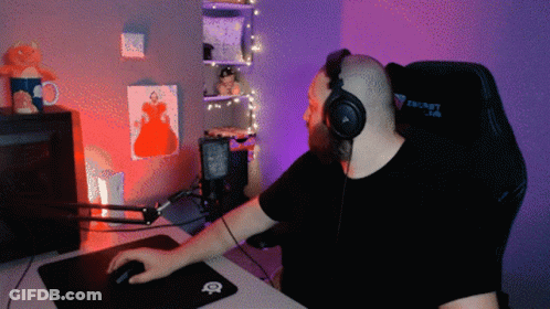 A Man Wearing Headphones Sits In A Secret Lab Gaming Chair GIF
