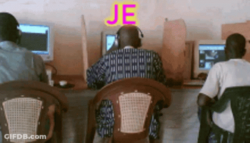 A Man Wearing Headphones Sits In Front Of A Computer With The Word Je Written Above Him GIF