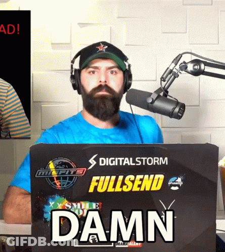 A Man Wearing Headphones Stands In Front Of A Digital Storm Fullsend Damn Sign GIF
