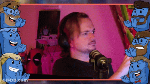A Man Wearing Headphones Stands In Front Of A Microphone GIF
