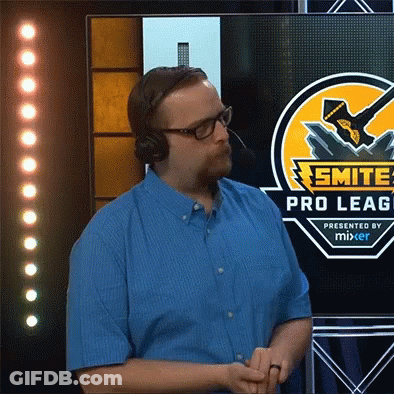 A Man Wearing Headphones Stands In Front Of A Screen That Says Smite Pro Leag Presented By Mixer GIF