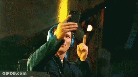 A Man Wearing Headphones Takes A Picture Of Himself GIF