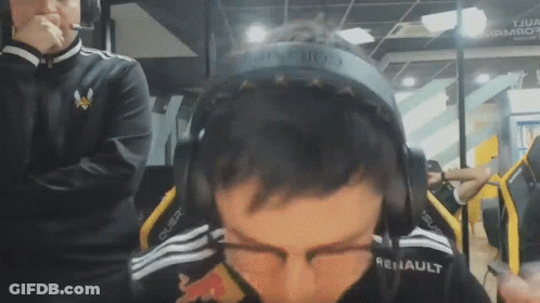 A Man Wearing Headphones That Say Renault On Them GIF