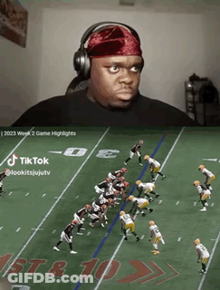 A Man Wearing Headphones Watches A Football Game On Tiktok GIF