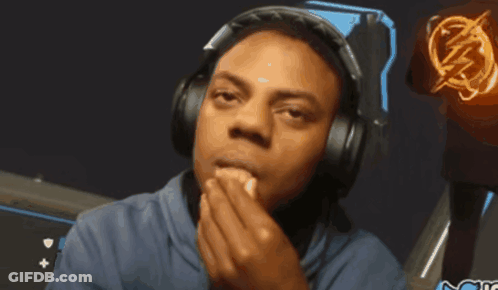 A Man Wearing Headphones With A Lightning Bolt On His Shirt GIF