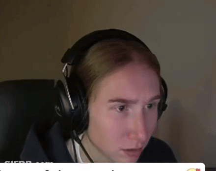 A Man Wearing Headphones With A Microphone Looks At The Camera GIF