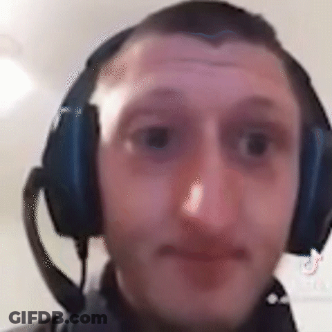 A Man Wearing Headphones With A Microphone On His Head . GIF