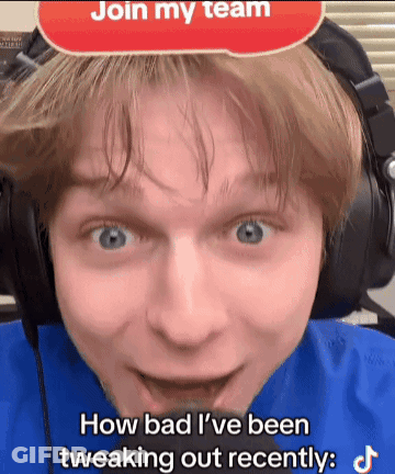 A Man Wearing Headphones With A Sign That Says Join My Team GIF