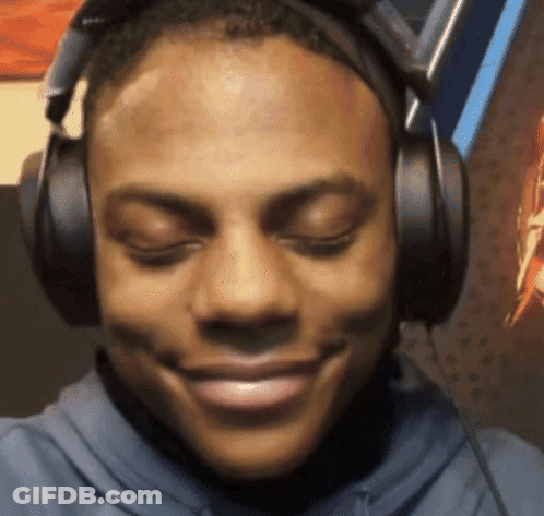 A Man Wearing Headphones With His Eyes Closed Smiles GIF
