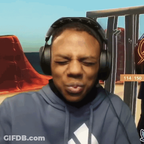A Man Wearing Headphones With The Number 114 On The Bottom GIF