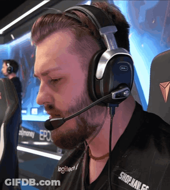 A Man Wearing Headphones With The Word Logitech On His Shirt GIF