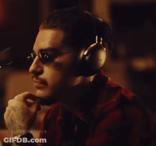 A Man Wearing Headphones With The Word Sony Written On It GIF