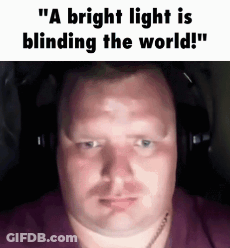 A Man Wearing Headphones With The Words " A Bright Light Is Blinding The World " On The Bottom GIF