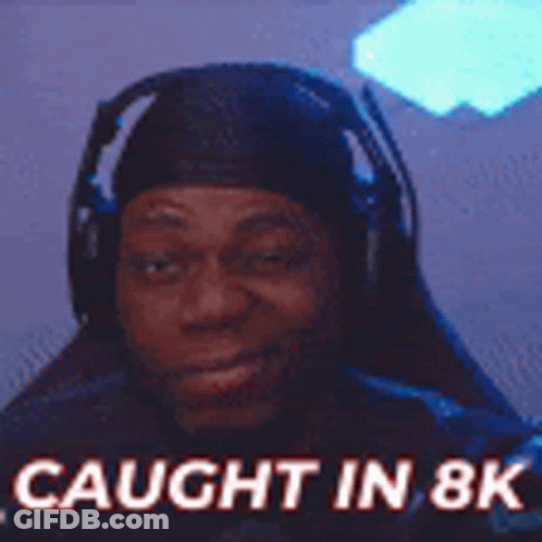 A Man Wearing Headphones With The Words `` Caught In 8K '' Written On It . GIF