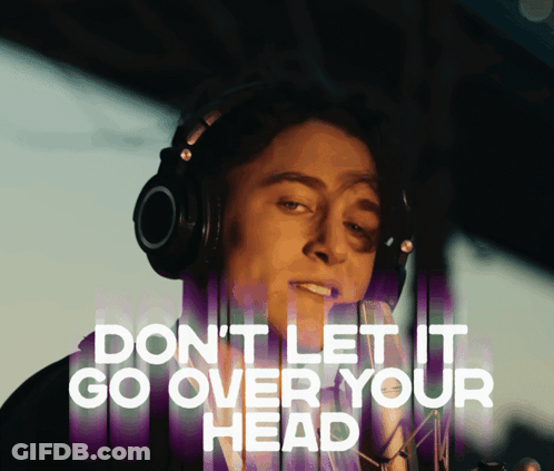 A Man Wearing Headphones With The Words " Do N't Let It Go Over Your Head " Above Him GIF