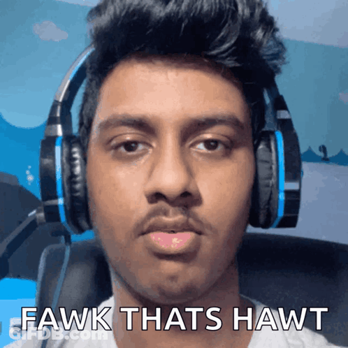 A Man Wearing Headphones With The Words Fawk Thats Hawt On The Bottom GIF