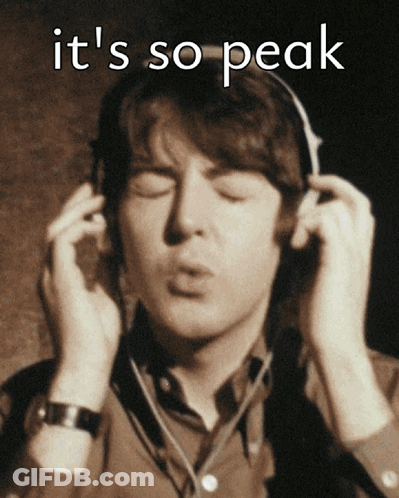 A Man Wearing Headphones With The Words It 'S So Peak Written Above Him GIF