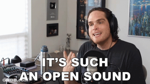 A Man Wearing Headphones With The Words It 'S Such An Open Sound Below Him GIF