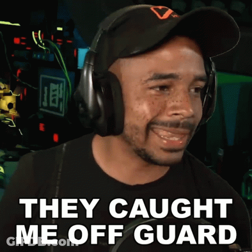 A Man Wearing Headphones With The Words They Caught Me Off Guard GIF