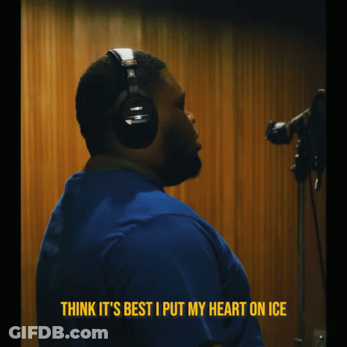 A Man Wearing Headphones With The Words Think It 'S Best I Put My Heart On Ice Above Him GIF