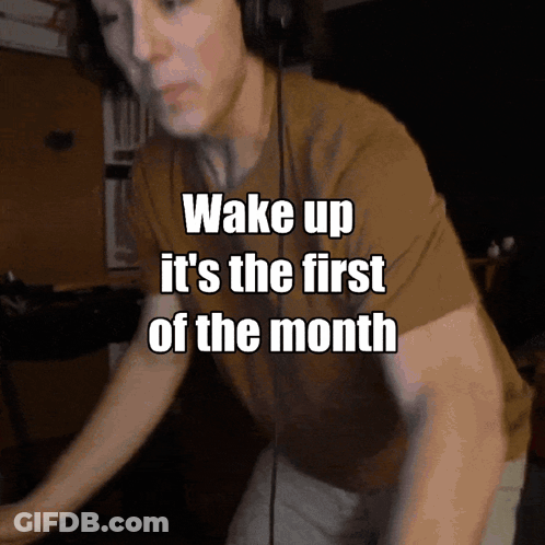 A Man Wearing Headphones With The Words Wake Up It 'S The First Of The Month GIF
