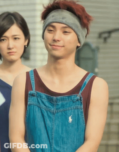 A Man Wearing Overalls And A Headband Has A Polo Logo On His Shirt GIF