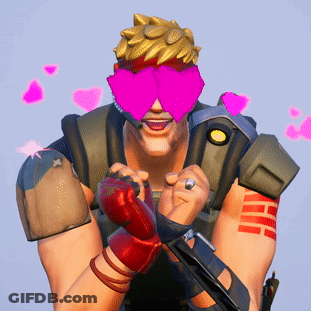 A Man Wearing Pink Glasses With Hearts On Them GIF