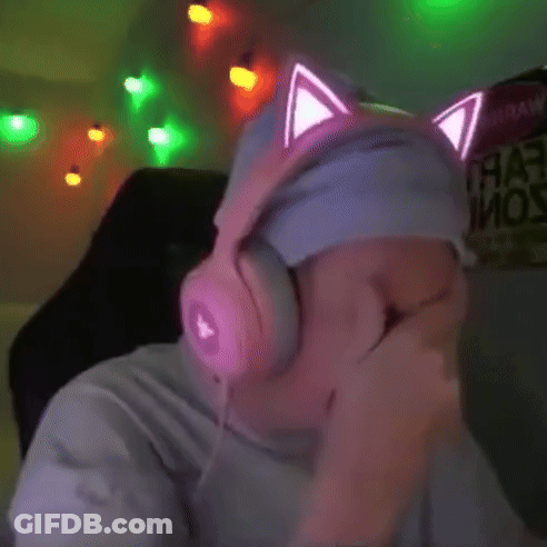 A Man Wearing Pink Headphones With Cat Ears On His Headband GIF