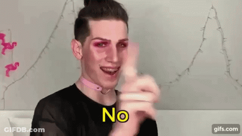 A Man Wearing Pink Makeup And A Choker Is Pointing At The Camera . GIF