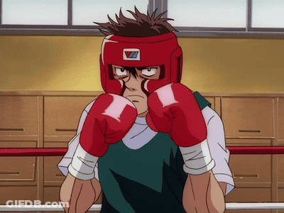 A Man Wearing Red Boxing Gloves And A Red Helmet With The Letter Z On It GIF