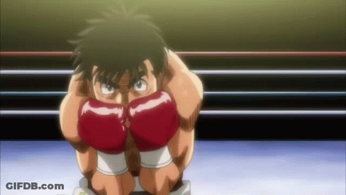 A Man Wearing Red Boxing Gloves Kneeling Down In A Ring GIF