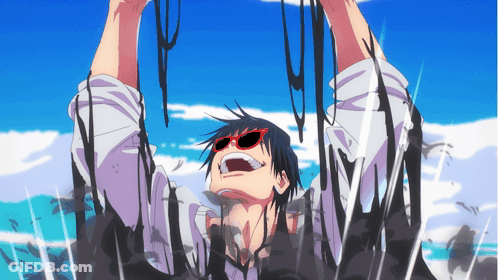 A Man Wearing Red Sunglasses Is Covered In A Black Substance GIF