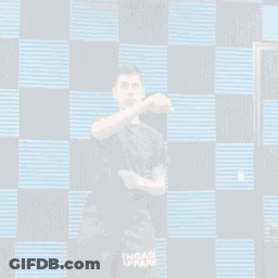 A Man Wearing Shorts That Say Engage Apparel Is Dancing GIF