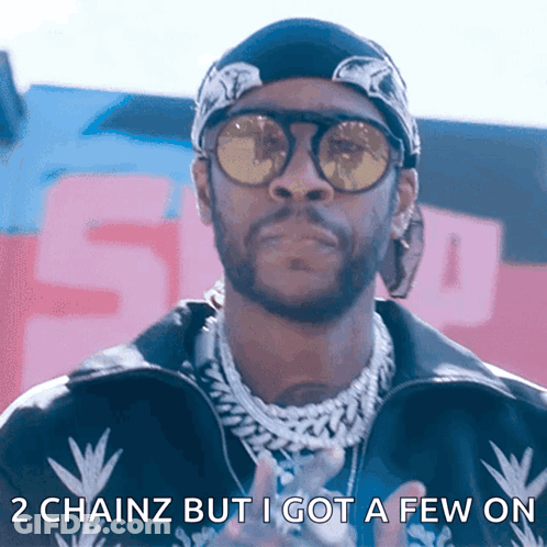 A Man Wearing Sunglasses And A Bandana Has The Words 2 Chainz But I Got A Few On Below Him GIF