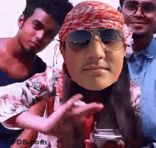 A Man Wearing Sunglasses And A Bandana Holds A Camera GIF