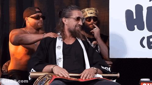 A Man Wearing Sunglasses And A Bandana That Says Gang Bang GIF